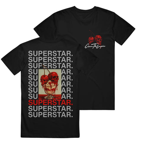 Crown The Empire black Gildan t-shirt with two red skull cherries and white cursive text on the front chest. Back features a large framed print of the skull cherries with repeated gray “SUPERSTAR.” text and one in red.