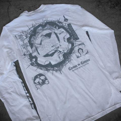 A white Crown The Empire Gildan Hammer Long Sleeves shirt with modern classic fit, featuring abstract black artwork—a jagged circle, skulls, and phrases like “Time will tell if there’s more to life” and “Grown to expire, immortalize” on the back.