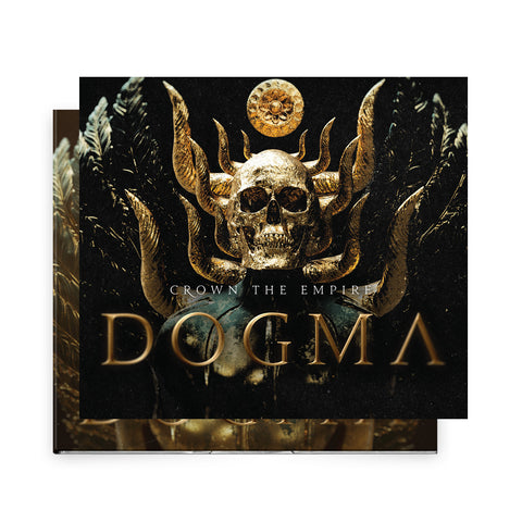 Album cover for DOGMA by Crown The Empire, showcasing a golden horned skull with a crown and black and gold wings. The dark background highlights the title, band name (Crown The Empire), and track list in the center.