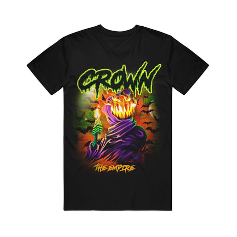 image of a black tee shirt on a white background. tee has full body print of a grim reaper with a glowing pumpkin head, holding a candle in front of flying bats. at the top says crown and the bottom says the empire