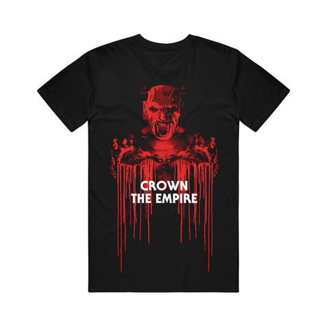 image of a black tee shirt on a white background. tee has full body print in red of a demon with bloody hands stretched out. over the image in white says crown the empire