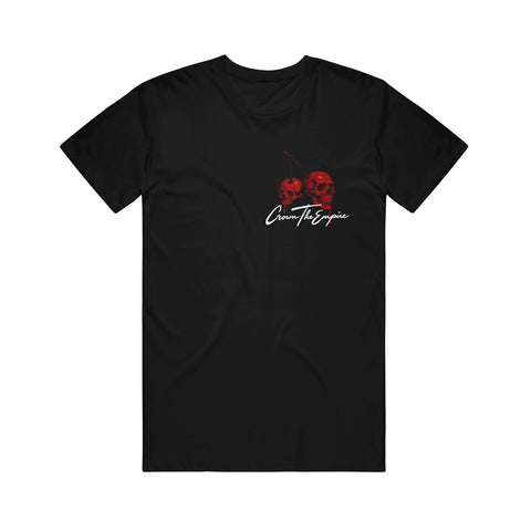 Black Gildan Hammer t-shirt with two red cherry-shaped skulls and stems above white cursive "Crown The Empire" text on the chest.