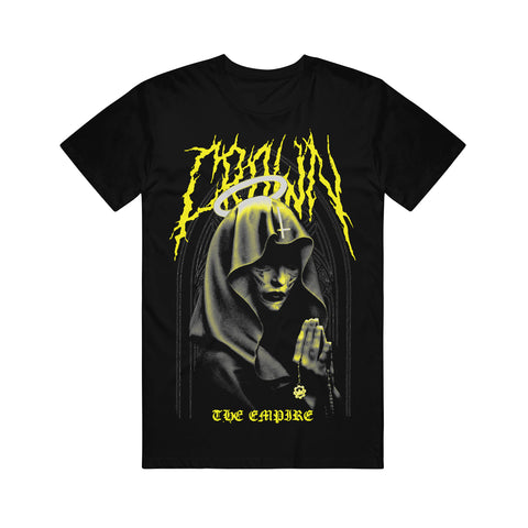 image of a black tee shirt on a white background. tee has a full body print. in yellow at the top says crown, with an image of a nun with a halo with praying hands holding a crown the empire cog necklace below, and the word empire at the bottom