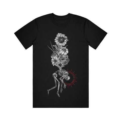 image of the front of a black tee shirt on a white background. tee has a full body print of a bouquet of flowered above a hunched over skeleton.