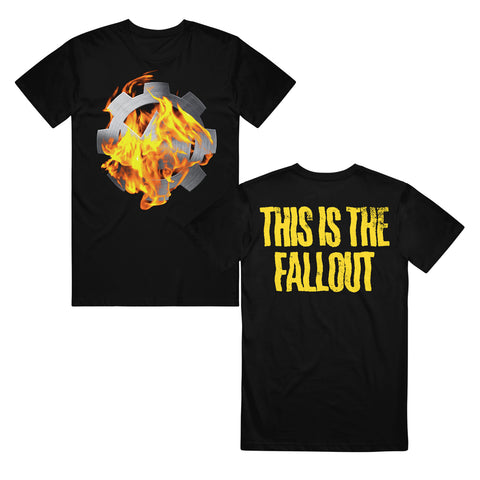 image of the front and back of a black tee shirt on a white background. front of the tee is on the left and has a full chest print of a cog on fire. the back of the tee is on the right and has yellow text across the shoulders that says this is the fallout.